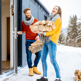 Man and Woman Carrying Firewood