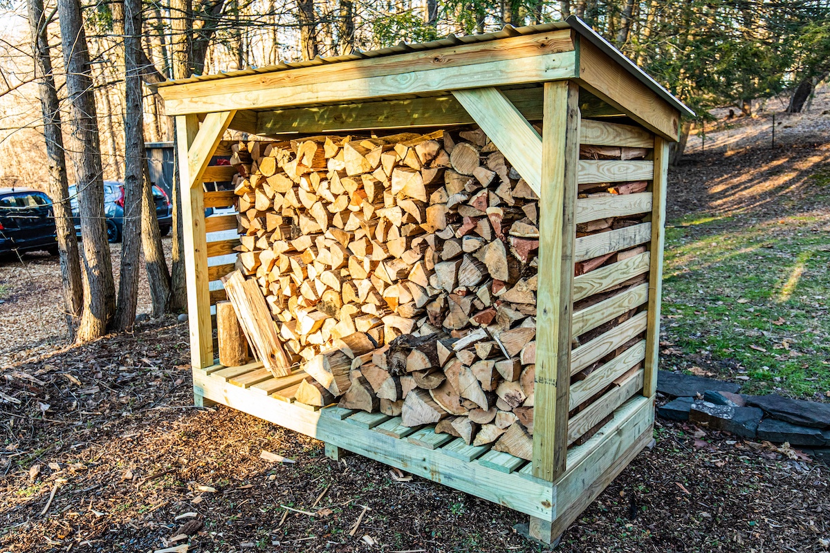 firewood rack of lumber chopped wood outside